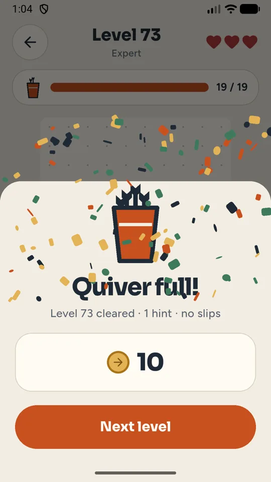 Level cleared screen with coins and a Next level button